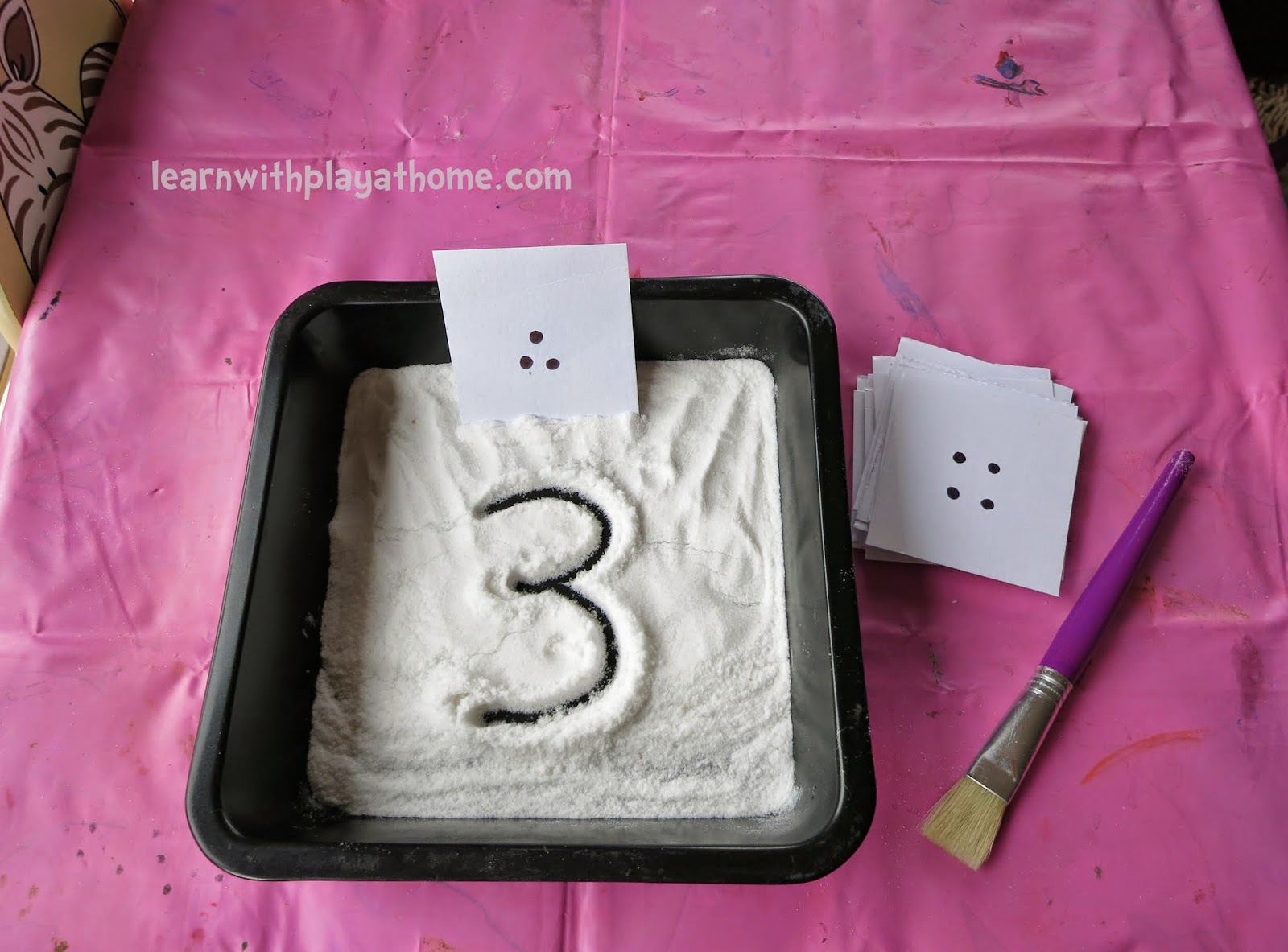 Learn with Play at Home Number Writing Activity. Salt Tray Game.