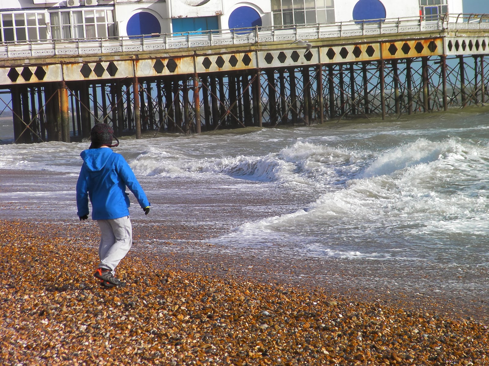 playing with waves on southsea beach derelict south parade pier southsea portsmouth