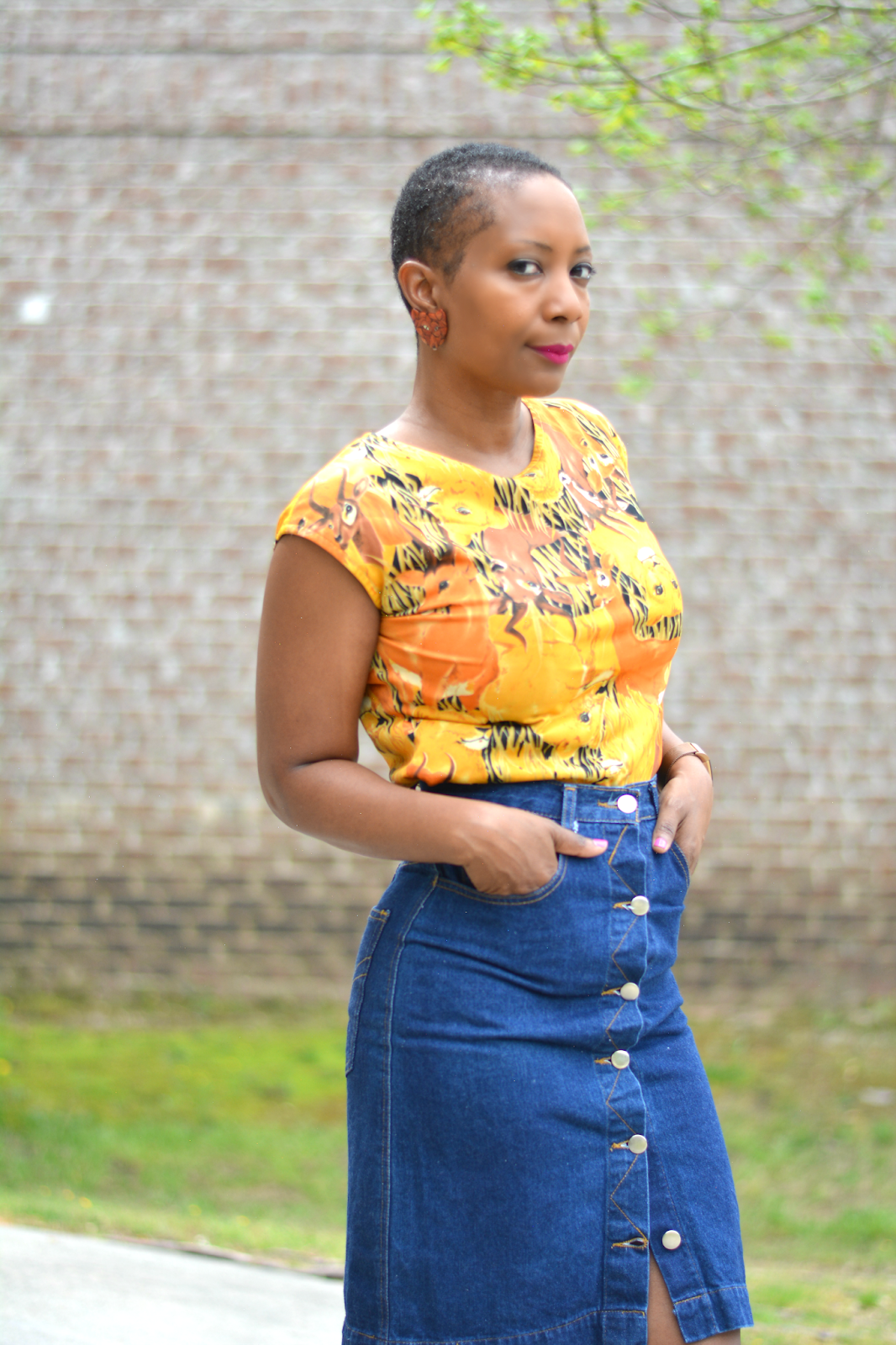 Thrift style featuring vintage button front jean skirt and safari animal print top.