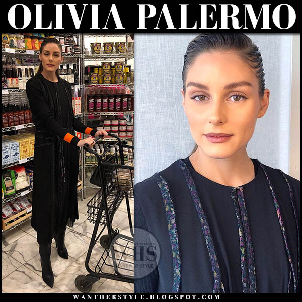 Olivia Palermo in black wrap midi dress and black orange detail sweater