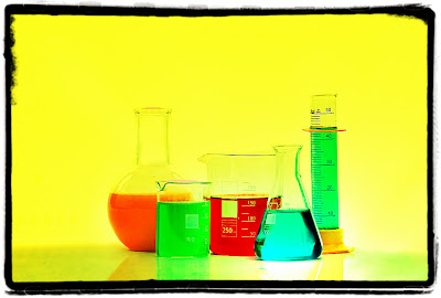 Liquids in chemistry flasks and beakers