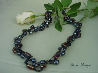 Handmade beaded necklace from black glass beads made by Gunadesign