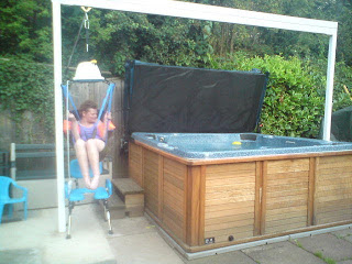 Bespoke gantry system for disabled access to hot tubs.
