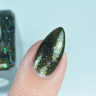 black nail polish with green and blue glitter