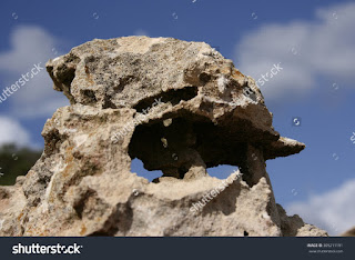 oddly shaped rocks in Formentera,Balearic Islands,Ibiza and Formentera photograph of rock formations as magical beings on the coast of the island of Formentera,Hippies, photographic tourism, blue sky oddly shaped rocks in Formentera,Balearic Islands,Ibiza and Formentera photograph of rock formations as magical beings on the coast of the island of Formentera,Hippies, photographic tourism, blue sky