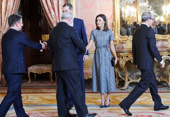 Queen Letizia wore Massimo Dutti wool check dress with belt. She wore Magrit pumps and carried Magrit clutch. Princess Leonor