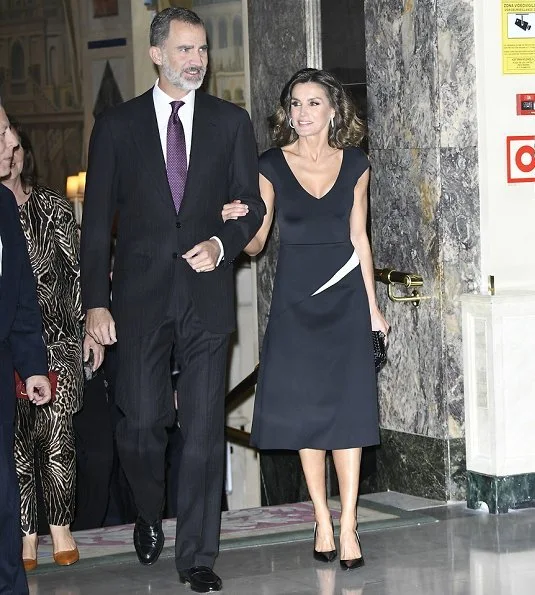 Queen Letizia wore Carolina Herrera dress and Carolina Herrera Pumps. carried Bottega Venata clutch bag. journalist Rubén Amón