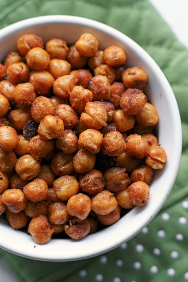 These insanely good Buffalo Roasted Chickpeas are a healthy and crunchy snack flavored with spicy buffalo sauce.