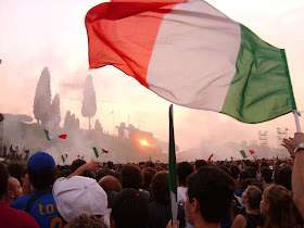 Italian fans celebrate at the Circus Maximus in Rome, where captain Fabio Cannavaro and his team showed off the trophy after winning the 2006 World Cup