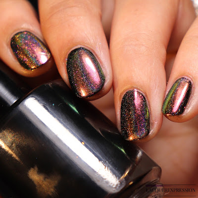 Swatch of Born Pretty Store peacock holographic nail powder item #40683 over black nail polish