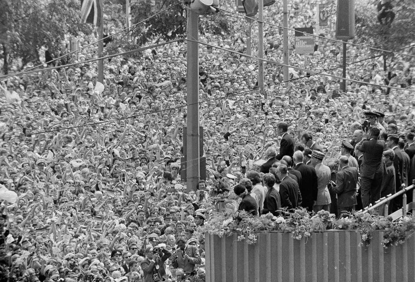 A cheering crowd, estimated by police at more than a quarter of a million, fills the area beneath the podium at West Berlin's City Hall, where U.S. President John F. Kennedy stood. His address to the City Hall crowd was one of the highlights of his June 26, 1963 visit to West Berlin, where he received one of the greatest receptions of his career.
