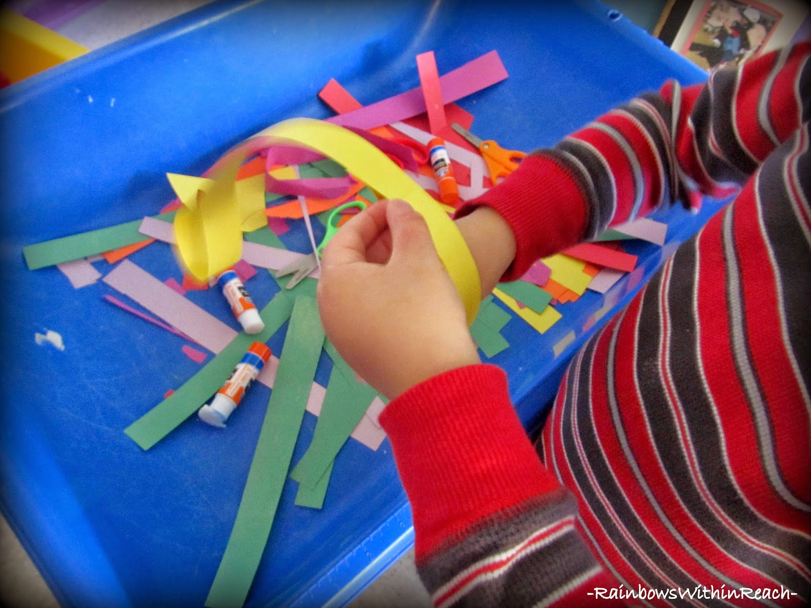 Sensory Table Exploration with Strips and Stripes of Color, Scissors and Glue Sticks! via PreK+K Sharing
