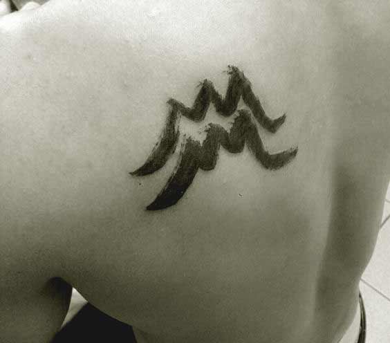 Aquarius tattoo design on shoulder blade for men
