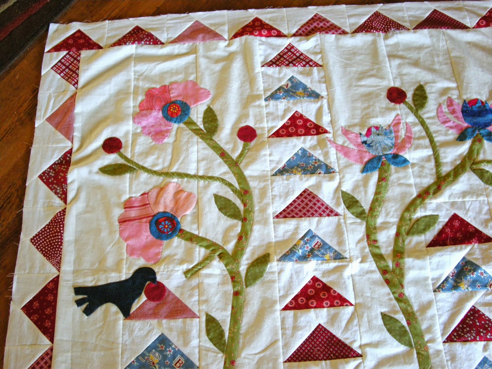 Quilty Folk Flowers and Flying Geese Gets a Border