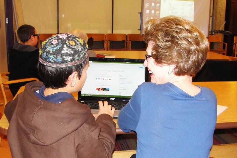 A teen and a senior at Adat Shalom Synagogue's 2nd annual Tech Connec