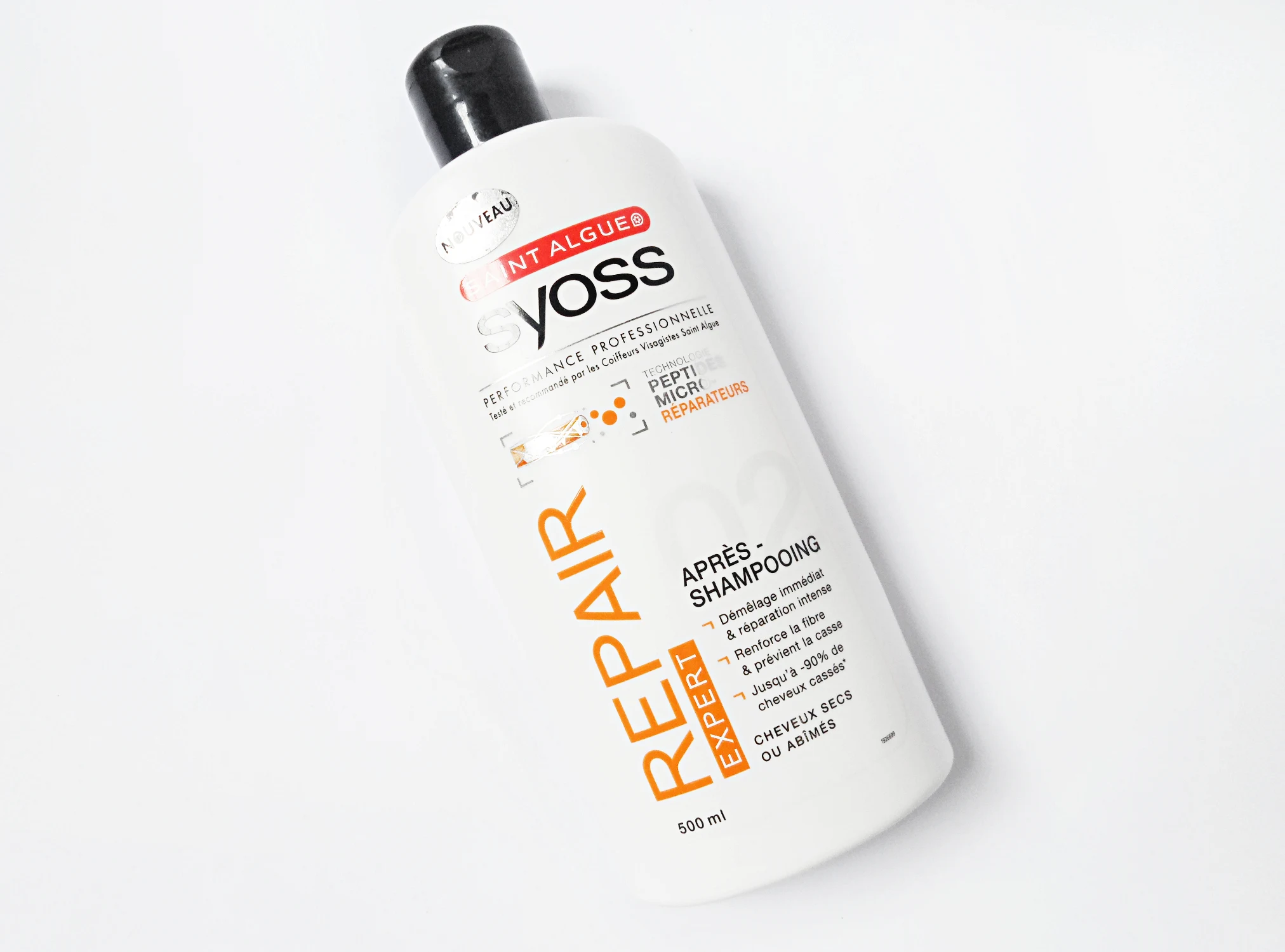 a close-up shot of Syoss Repair Therapy Hair Care Product Conditioner on a plain white background