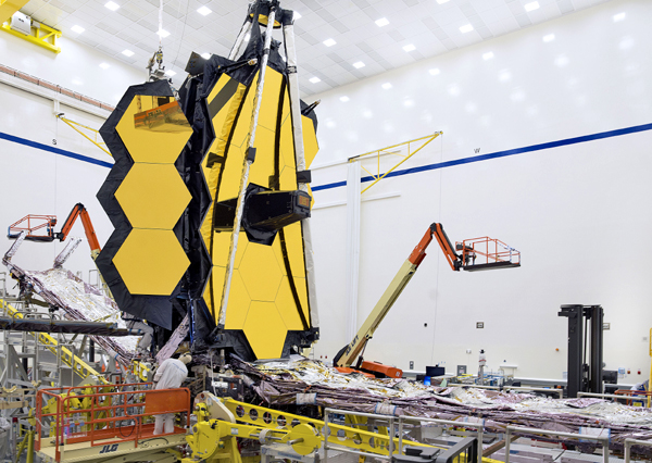 Engineers work on NASA's James Webb Space Telescope at the Northrop Grumman facility in Redondo Beach, California. Engineers work on NASA's James Webb Space Telescope at the Northrop Grumman facility in Redondo Beach, California.