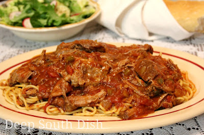 Spaghetti Daube is a well loved Deep South dish and not surprising because it is such a budget stretcher. A slow braised beef, it is cooked in, then shredded & returned to a lovely Creole sauce. Serve over spaghetti noodles.