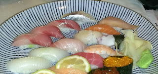 plate of various sushi and rolls