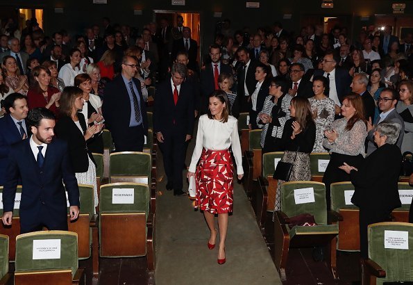 Queen Letizia wore a new printed skirt by Hugo Boss, and wore Carolina Herrera white cashmere coat, and Hugo Boss silk top