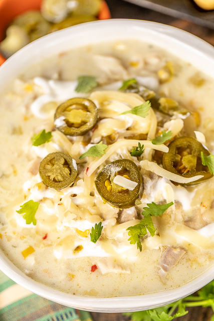 Chicken & Corn Chowder - crazy delicious and ready in 30 minutes! Chicken, onion, garlic, cumin, chicken broth, half-and-half, pepper jack cheese, corn kernels, creamed corn and green chiles. I wanted to lick the bowl! Great for a crowd. Top the chowder with some sour cream, jalapeños and extra cheese. All you need is some cornbread and you are set! The BEST!! #chicken #soup #chickensoup Chicken & Corn Chowder - crazy delicious and ready in 30 minutes! Chicken, onion, garlic, cumin, chicken broth, half-and-half, pepper jack cheese, corn kernels, creamed corn and green chiles. I wanted to lick the bowl! Great for a crowd. Top the chowder with some sour cream, jalapeños and extra cheese. All you need is some cornbread and you are set! The BEST!! #chicken #soup #chickensoup