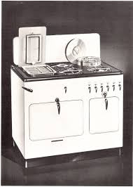 Front view of Model B Chambers vintage stove with black cooktop showing broiler under griddle and pots in Thermo-Well