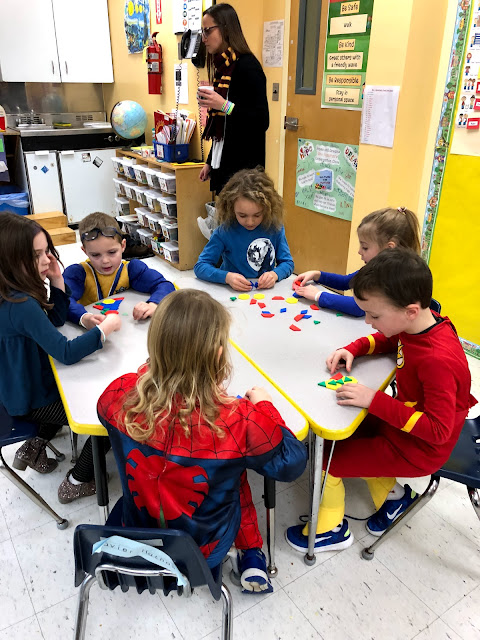 Kindergarten students learn how to sort and classify shapes.