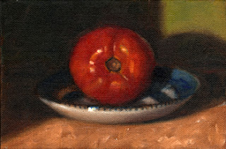 Oil painting of a red tomato on a blue and white porcelain saucer.