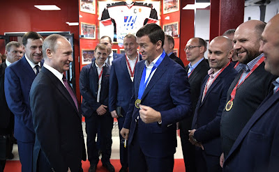 Russian President with the players of the team Neoplan, winners of the 2014 Night Hockey League tournament. Russian President with the players of the team Neoplan, winners of the 2014 Night Hockey League tournament.
