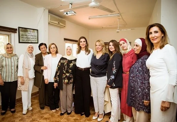 Queen Rania wore FRAME Le Palazzo Pants and STELLA MCCARTNEY Marion Split Sleeve Cady top during visit to Families Development Association