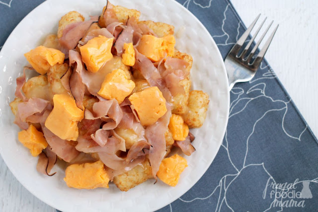 Fresh cheese curds and ham are served over top of crispy tater tots and then smothered in a turkey gravy in this easy to make Ham & Cheese Tater Tot Poutine.