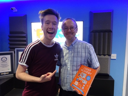 Dan and Sean in the studio, with a copy of Coder Academy in Sean's hand