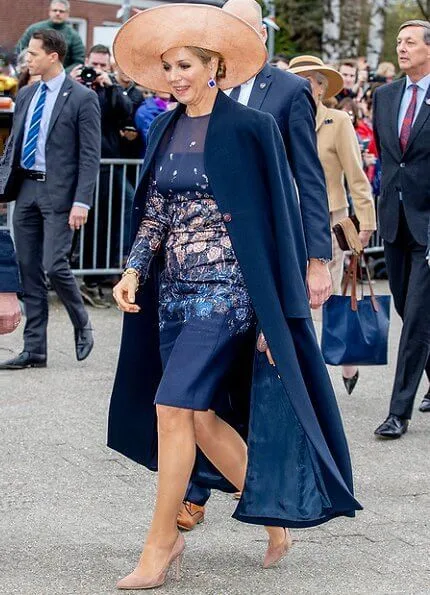 Queen Maxima wore a new embroidered dress by Natan Couture. The company is now officially named Royal Swinkels Family