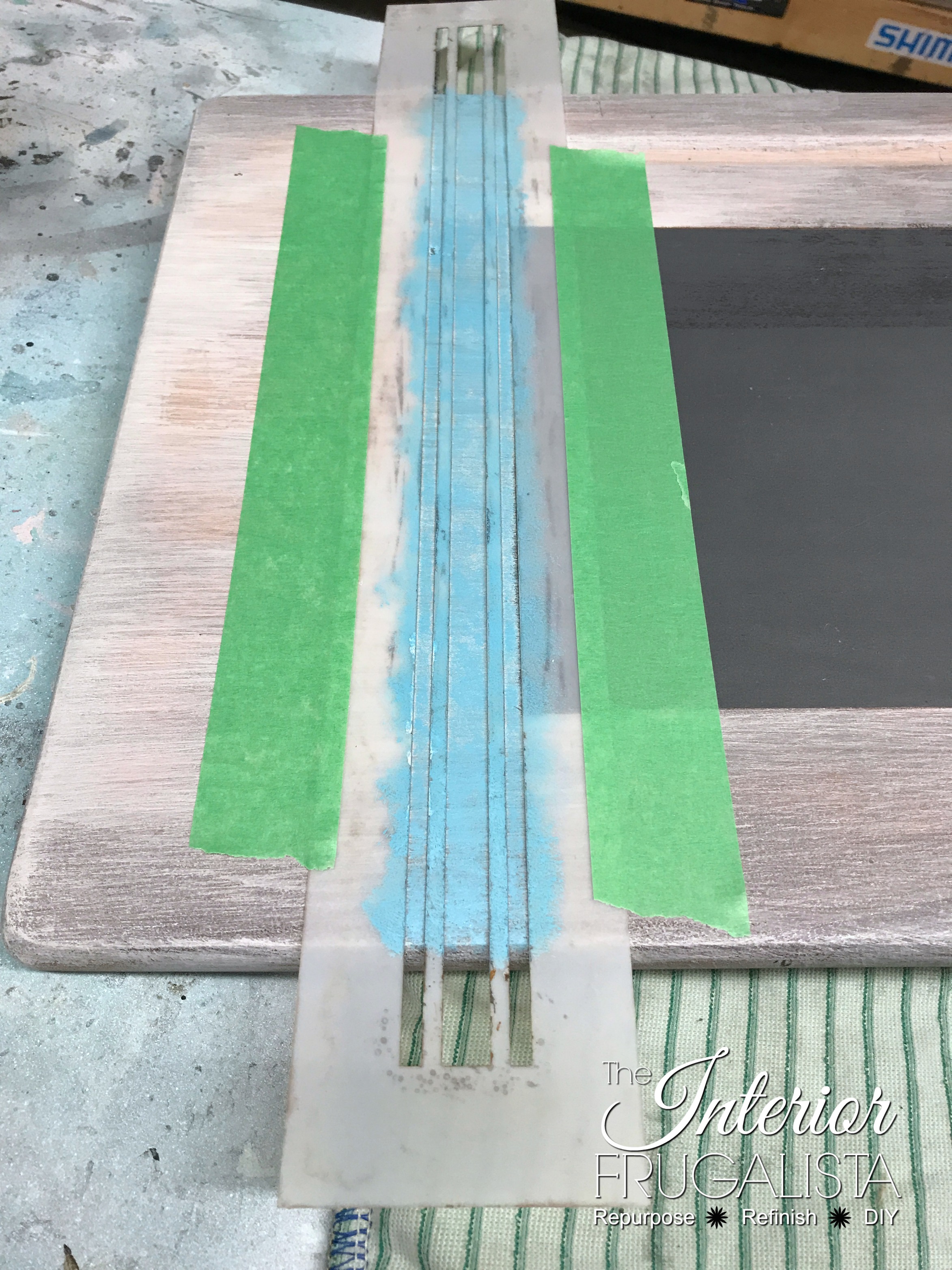 How to upcycle a vintage metal and wood classroom desk with bright turquoise paint and a whitewash finish plus a DIY chalkboard top writing slate.