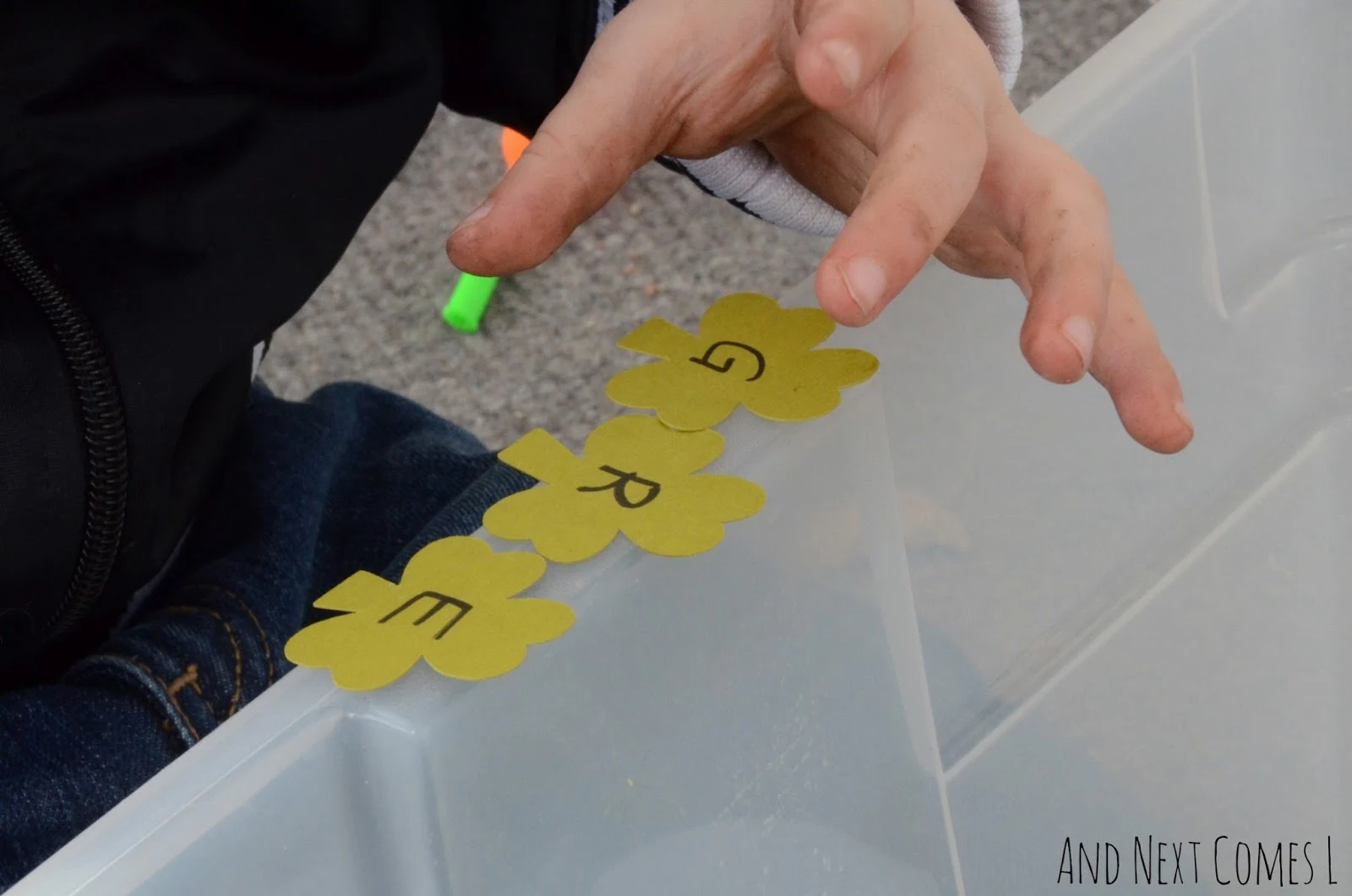 Spelling St. Patrick's Day words with a literacy rich sensory bin from And Next Comes L