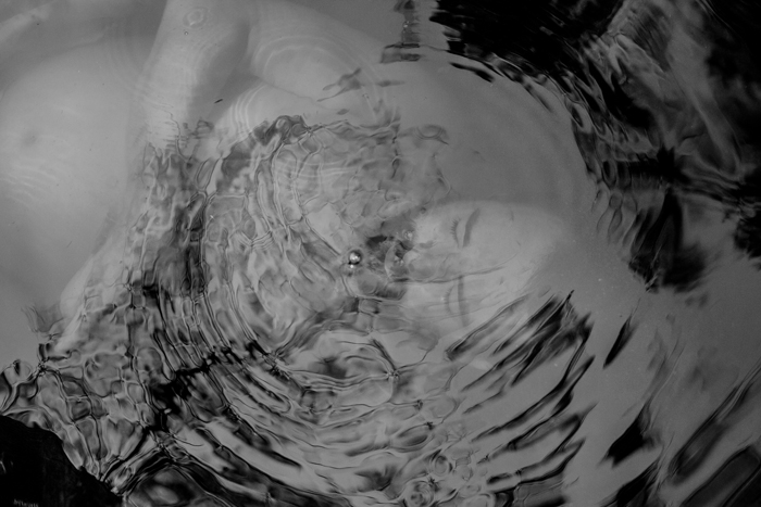 ben in water black and white underwater photo