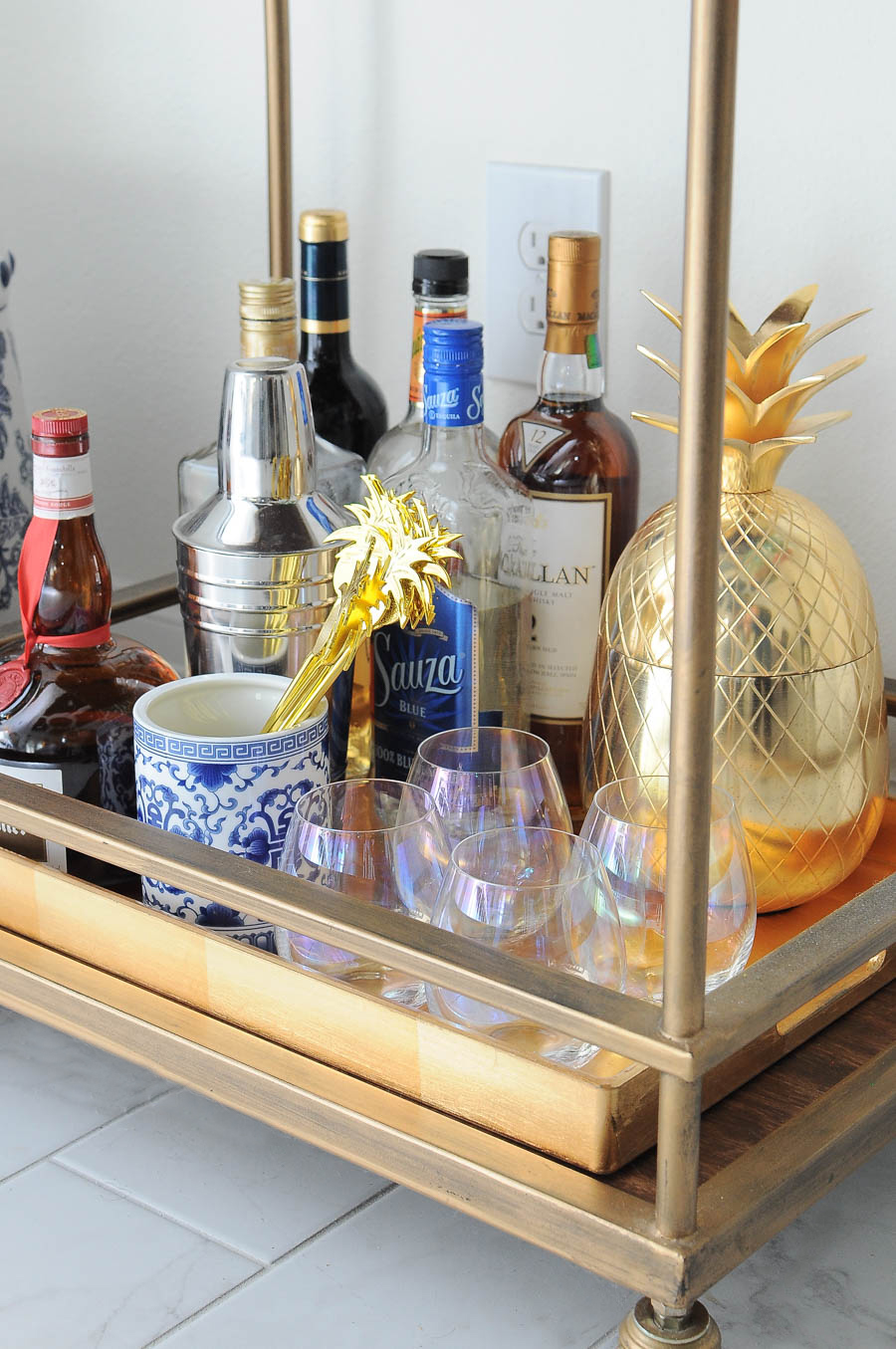 Spring bar cart decor styling ideas- florals, candles, liquor, and lots of chic and glam accents. Spring bar cart decor styling ideas- florals, candles, liquor, and lots of chic and glam accents.