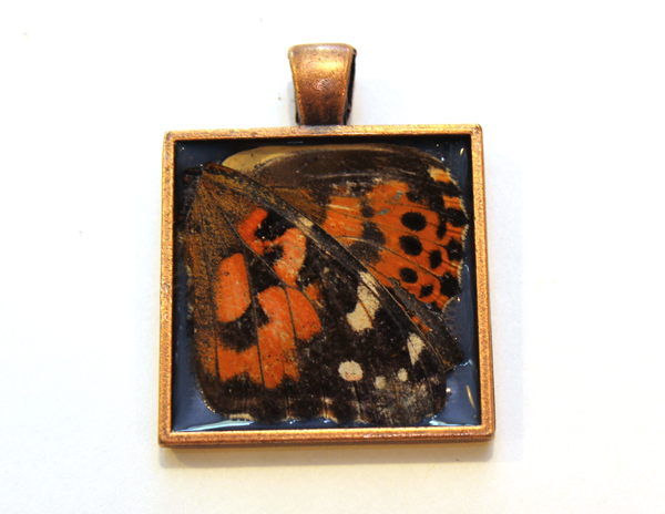 butterfly wings laid into necklace