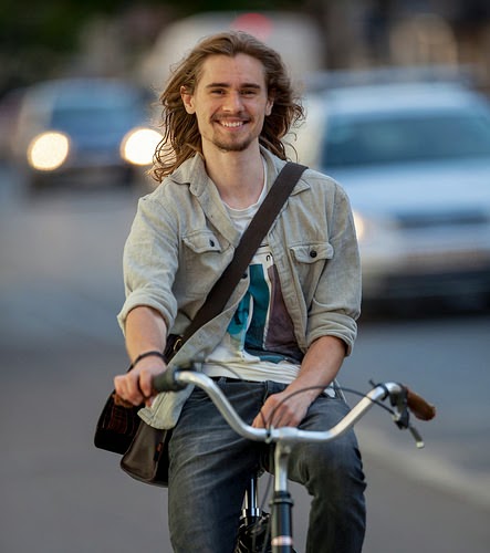 Hipster Danish Cyclist Smiles for the Camera