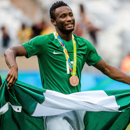 Mikel Obi with the Nigeria flag Mikel Obi with the Nigeria flag
