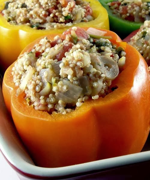 Bell Peppers Stuffed with Quinoa, Onions, Garlic, Spinach, and Tomatoes