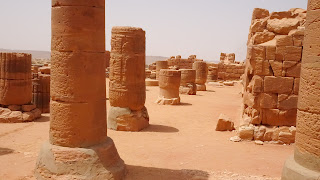 The area includes temples, low walls, passages
