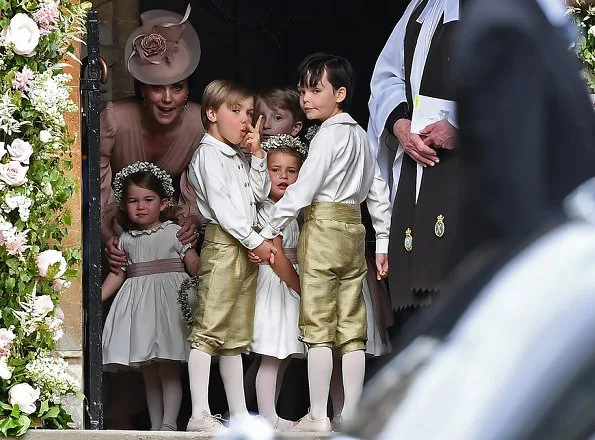 Duchess Catherine, her children Prince George of Cambridge, page boy and Princess Charlotte of Cambridge, flower girl attend the wedding of Pippa Middleton