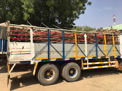 Photogist: Nigeria Customs Discover Car In A Truck Loaded With Firewood