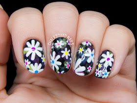 Electric daisy nail art by @chalkboardnails