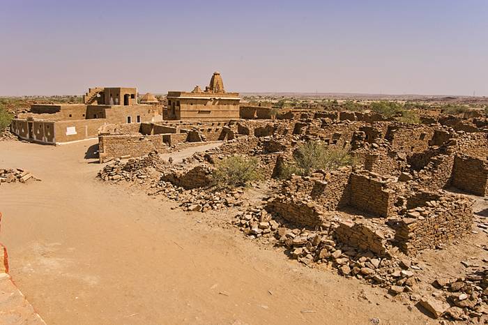 Kuldhara village near Jaisalmer has a very unique history! It is said that the residents of 84 neighboring villages including Kuldhara vacated the villages overnight around 170 years back!! No one is sure where they have gone, but they are believed to have migrated to a place somewhere near Jodhpur. The residents were Paliwal Brahmans — said to be very intelligent, and residing there for about 500 years. So what made them do such an act? Stories say that the ruler of these villages pounded the Paliwals with heavy taxes and treated them very inhumanly; the ruler was unethical and forceful to them. They had no alternative, but to vacate all the 84 villages overnight and just disappear from the vision and reach of the ruler.  When the Paliwals left the villages, they left a curse that nobody can inhabit the villages ever. Residents of Jaisalmer say that there have been some attempts by some families to stay there, but they did not succeed.