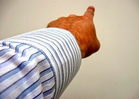 A man pointing a finger blaming others. A man pointing a finger blaming others.
