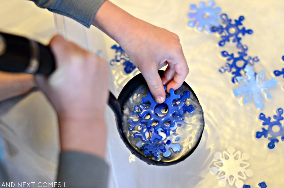 Winter sensory bin ideas with snowflakes and peppermint scented water