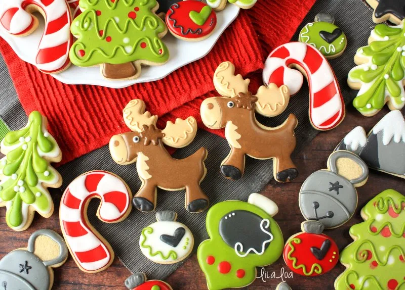 Cute and fun Christmas sugar cookies -- ornaments, tree, moose, mistletoe, bells, and candy canes