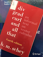 Div, Grad, Curl, and All That, by H. M. Schey, superimposed on Intermediate Physics for Medicine and Biology.